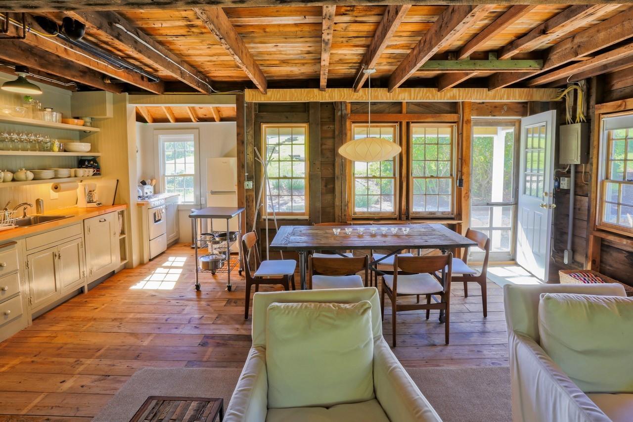 53 Depot Road Truro, MA 02666 - Photo 25 of 29 a living room with furniture a wooden floor and next to a window