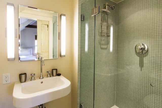 53 Depot Road Truro, MA 02666 - Photo 27 of 29 a bathroom with a sink a mirror and shower