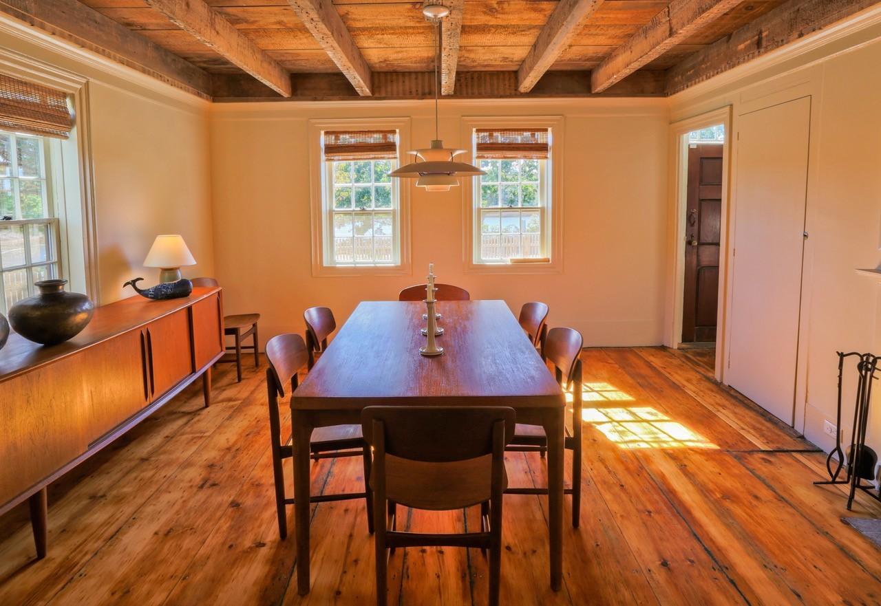 53 Depot Road Truro, MA 02666 - Photo 6 of 29 a view of a dining room with furniture and wooden floor