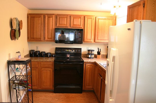 369 County Road Marion, MA 02738 - Photo 11 of 21 a kitchen with a refrigerator and a stove top oven