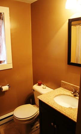 369 County Road Marion, MA 02738 - Photo 19 of 21 a bathroom with a granite countertop toilet and a sink
