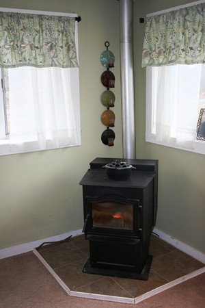 369 County Road Marion, MA 02738 - Photo 20 of 21 a living room with a fireplace and windows