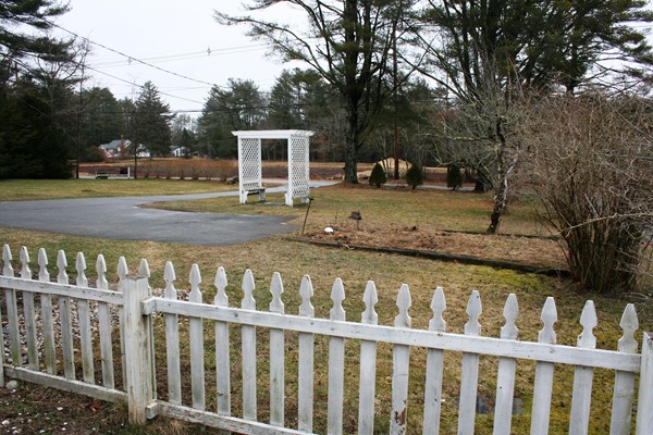 369 County Road Marion, MA 02738 - Photo 6 of 21 a view of a yard with wooden fence