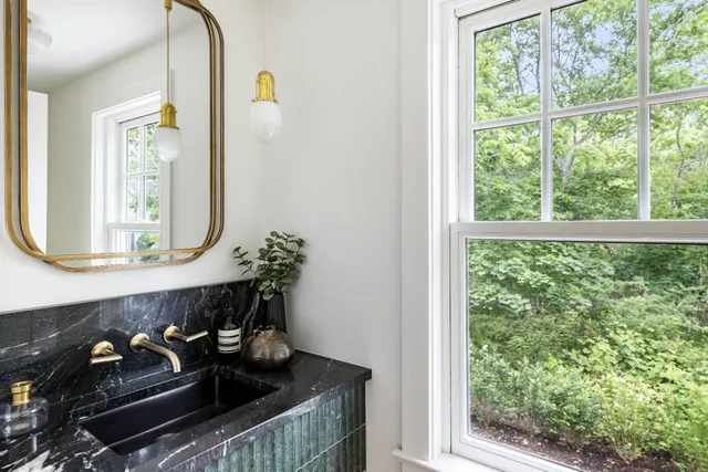 a kitchen with a stove and a window