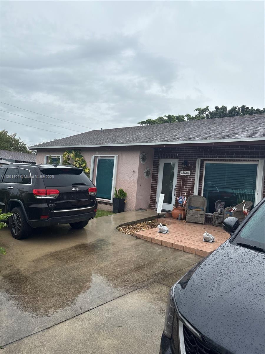12601 Southwest 268th Street Homestead, FL 33032 - Photo 11 of 17 a view of a car parked in garage