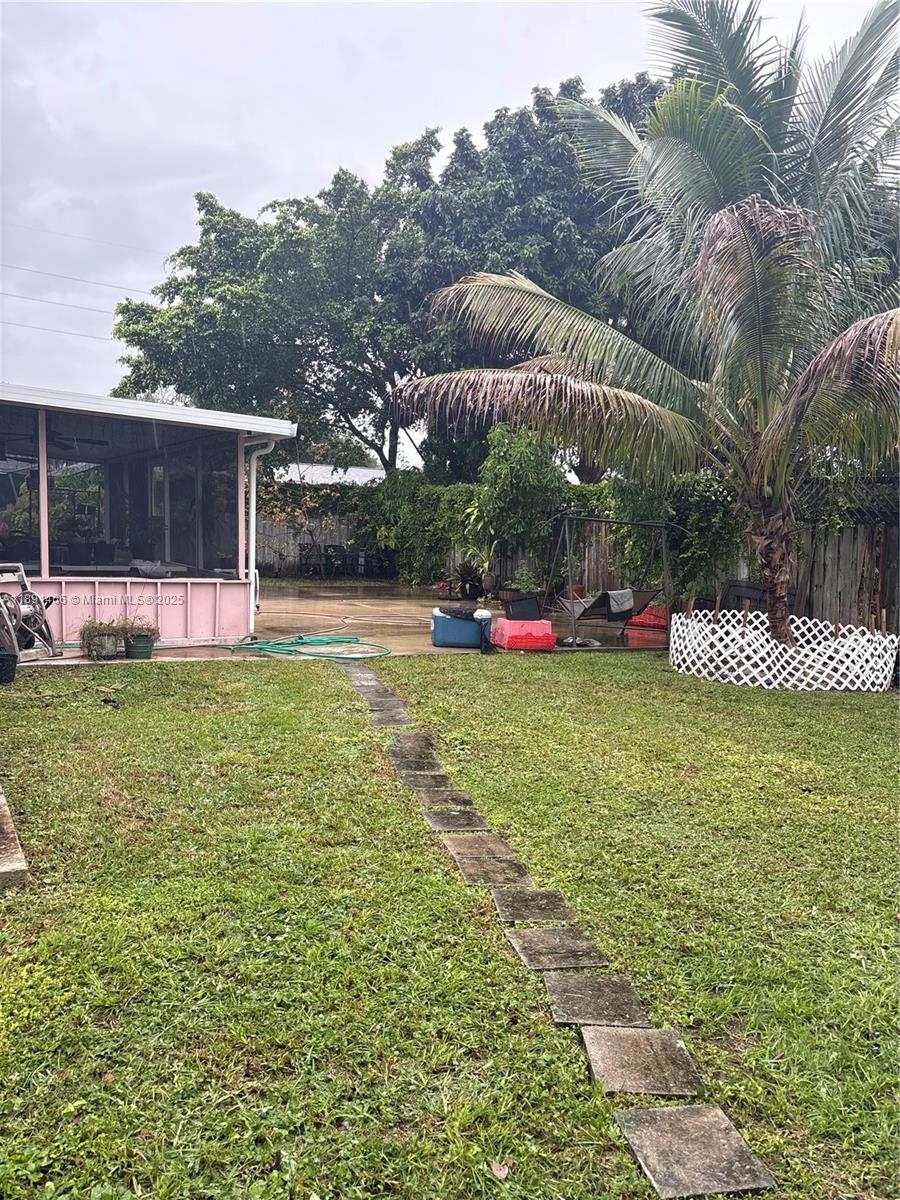 12601 Southwest 268th Street Homestead, FL 33032 - Photo 12 of 17 a view of a garden with plants and large trees