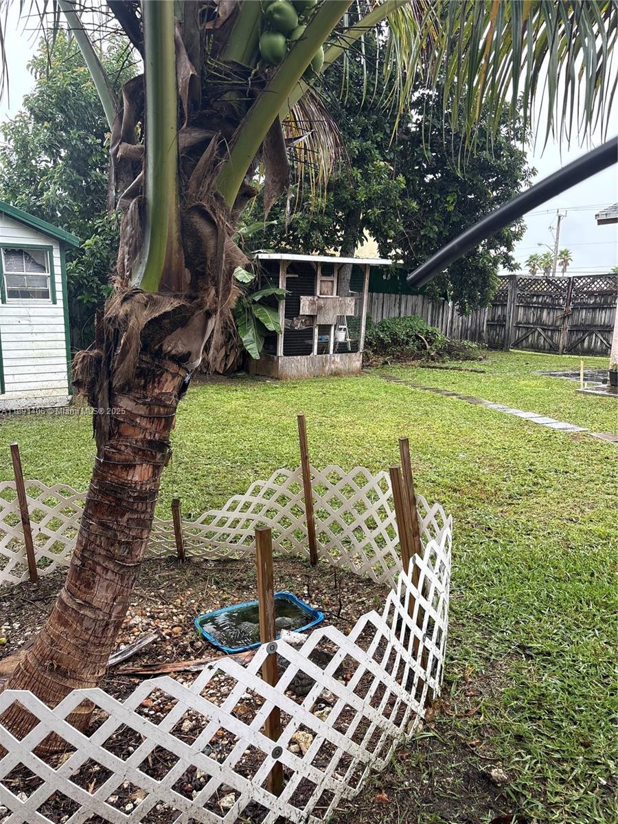 12601 Southwest 268th Street Homestead, FL 33032 - Photo 13 of 17 a view of a chairs and table in the patio