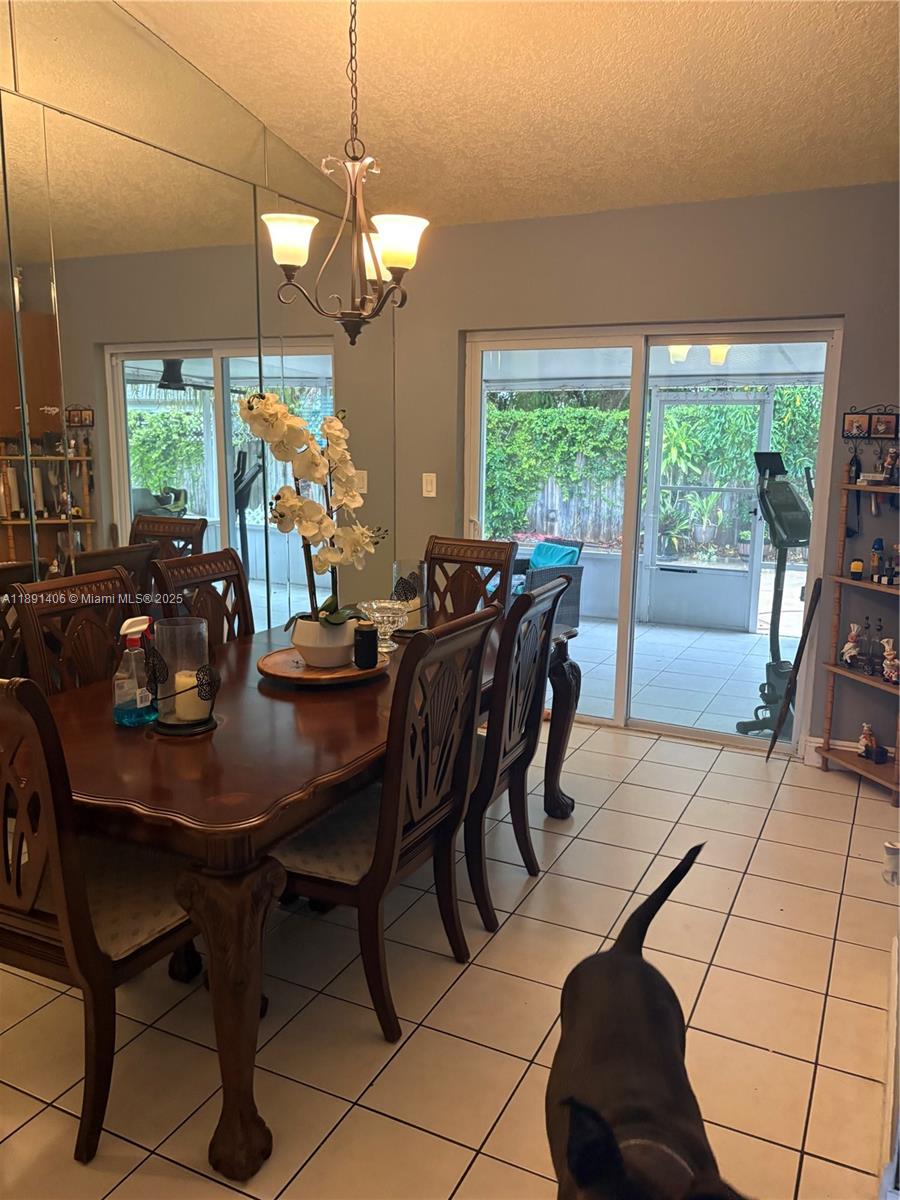12601 Southwest 268th Street Homestead, FL 33032 - Photo 5 of 17 a view of a dining room with furniture window and outside view