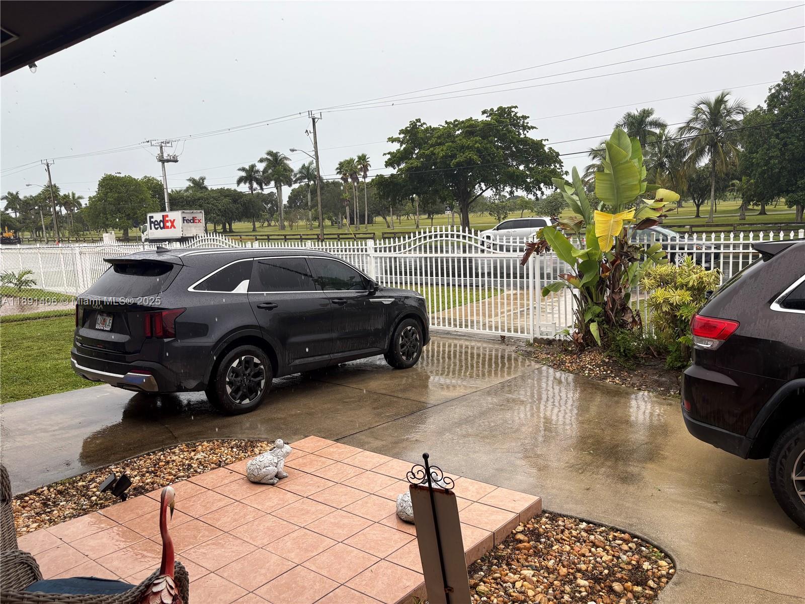 12601 Southwest 268th Street Homestead, FL 33032 - Photo 10 of 17 a view of a cars park in front of a house