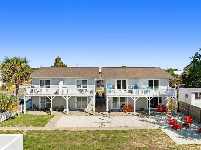 a view of a house with wooden floor and a chair
