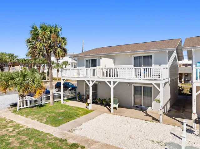 a view of a dining room with furniture and window