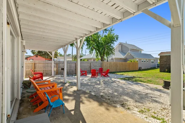 a living room with furniture wooden floor and dining room
