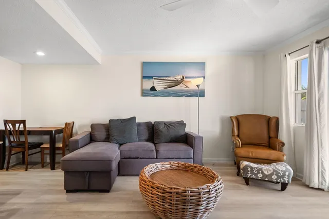 a kitchen with stainless steel appliances granite countertop a refrigerator sink and white cabinets