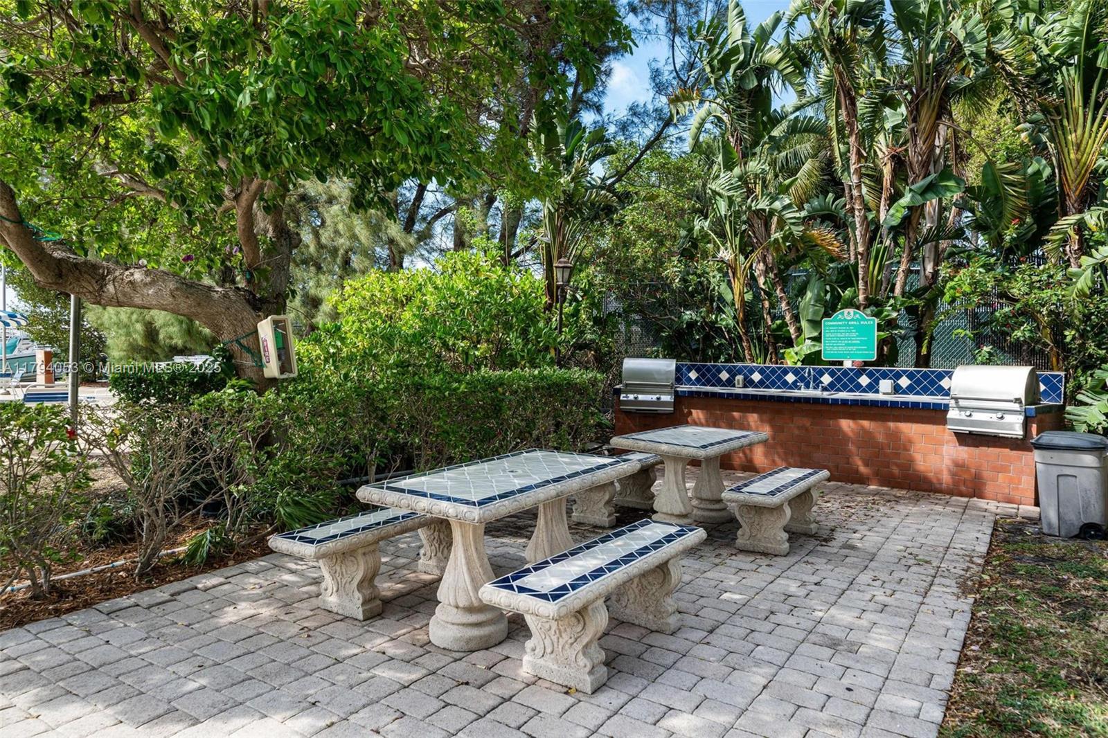 150 Southeast 25th Road, Unit 2H Miami, FL 33129 - Photo 15 of 15 a view of a chairs and table in the patio