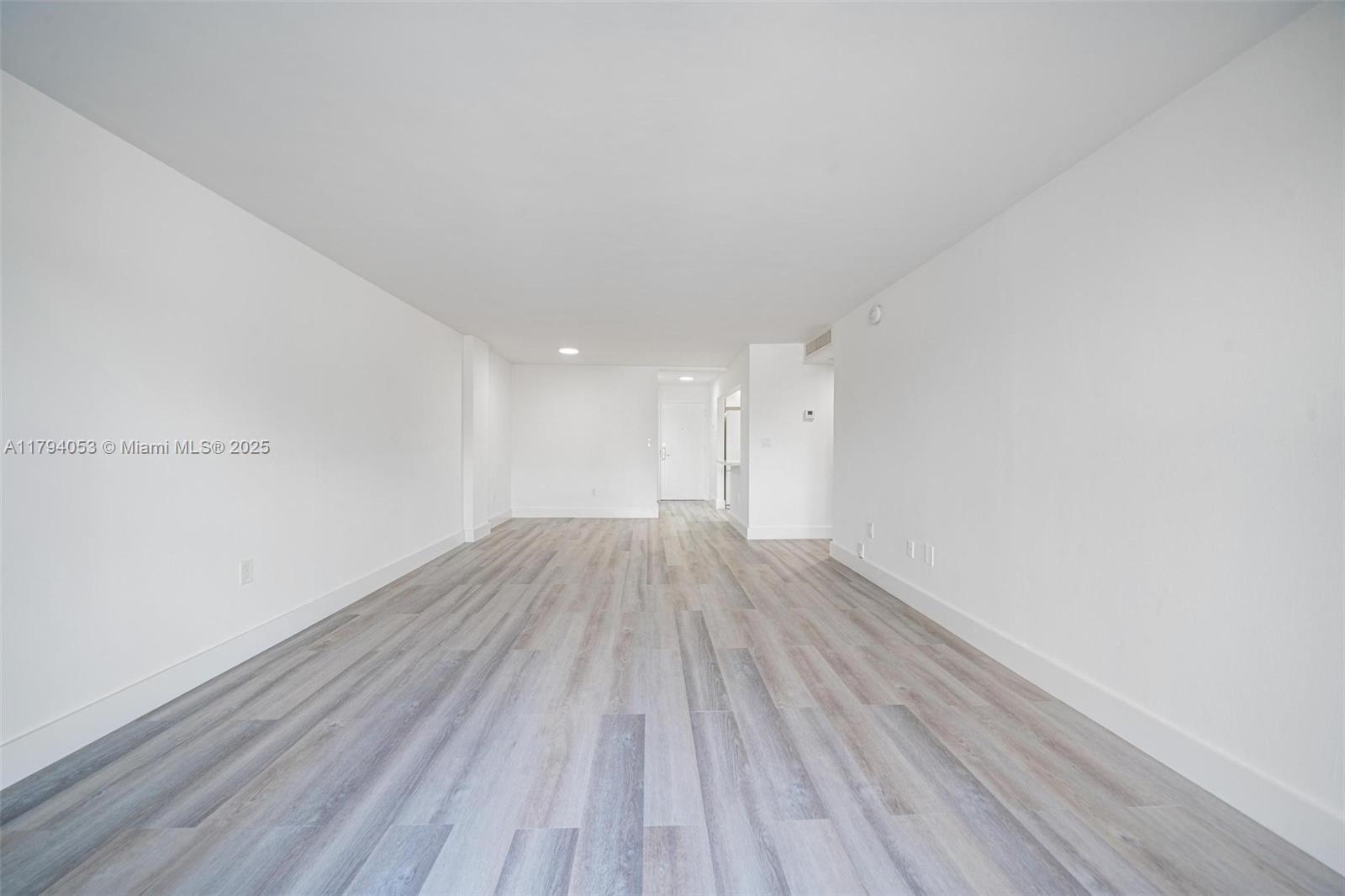 150 Southeast 25th Road, Unit 2H Miami, FL 33129 - Photo 3 of 15 a view of wooden floor in a room