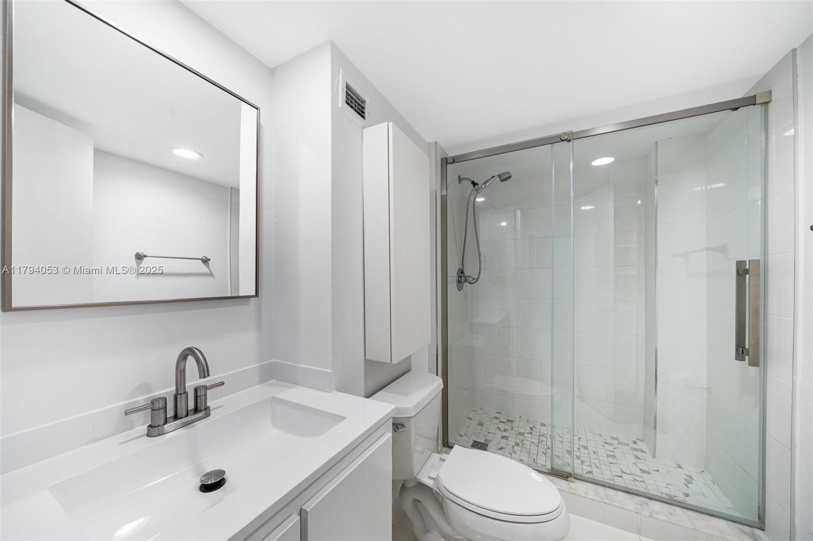 150 Southeast 25th Road, Unit 2H Miami, FL 33129 - Photo 9 of 15 a bathroom with a sink toilet and shower