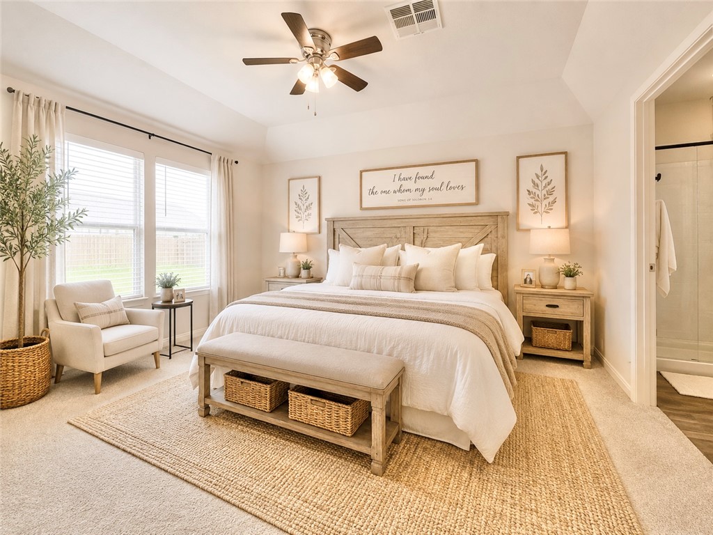 137 Windmill Road Somerville, TX 77879 - Photo 8 of 17 a spacious bedroom with a bed a couch and a large window