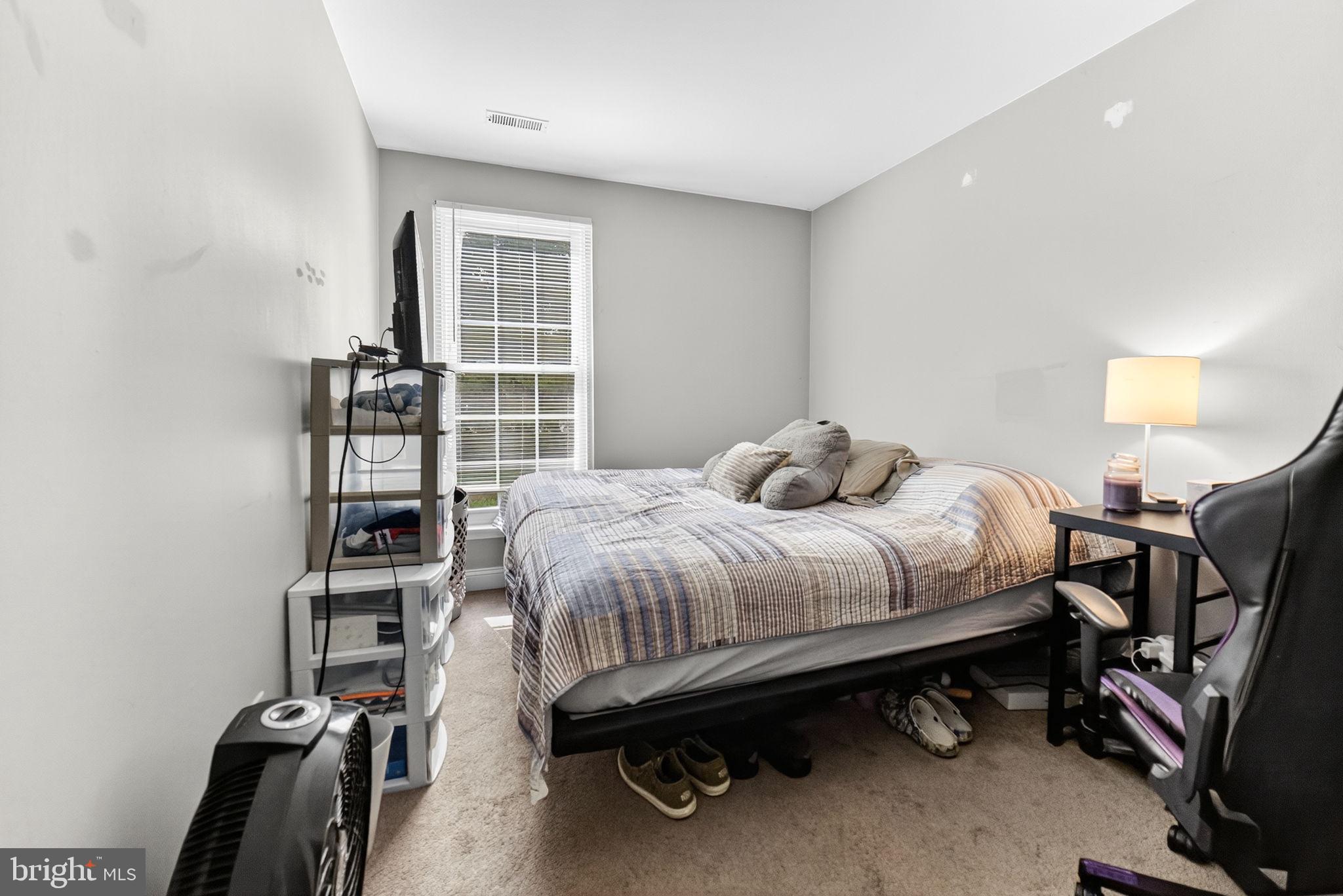 22 Meadow Lane New Hope, PA 18938 - Photo 14 of 21 a bedroom with a bed and a bookshelf