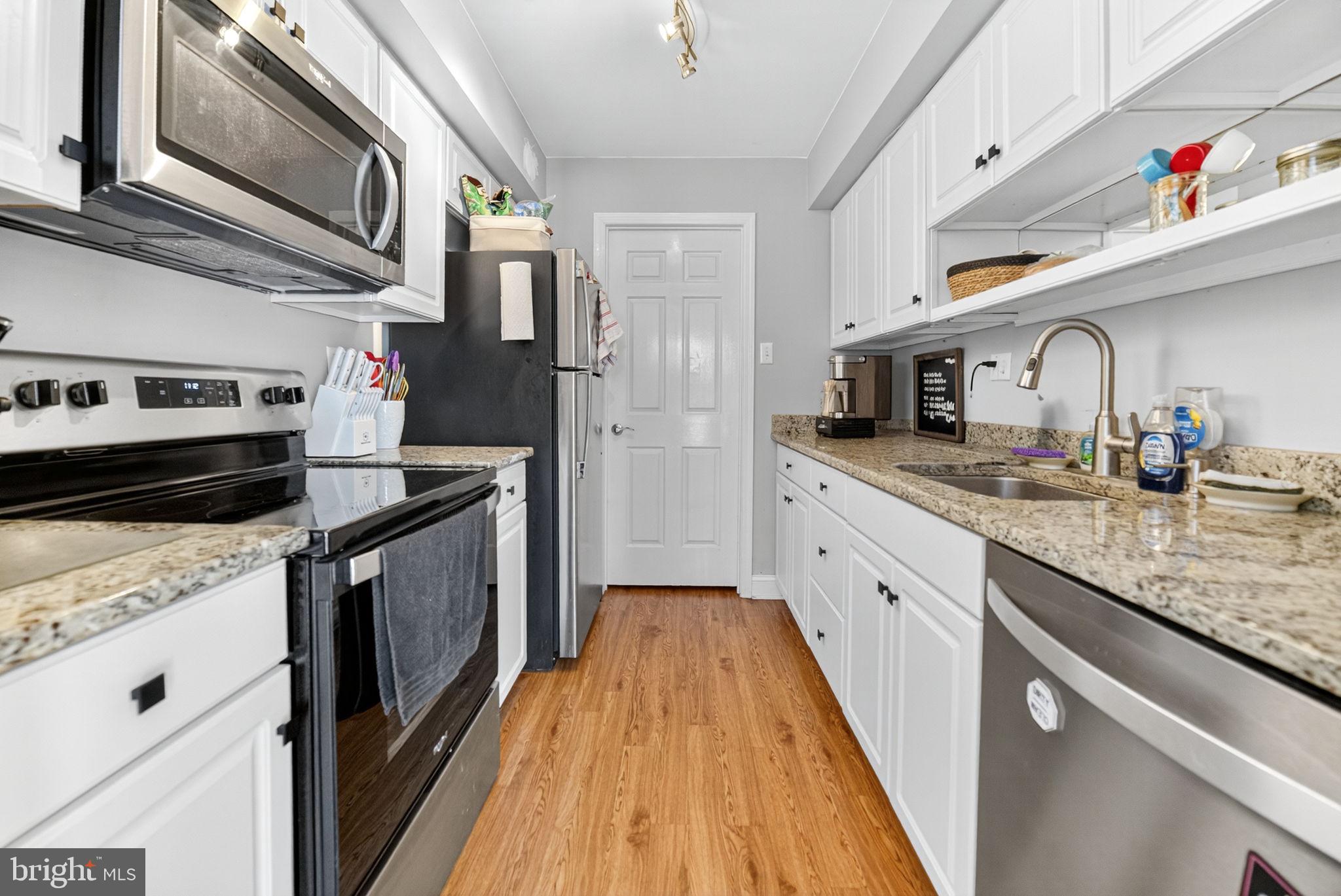 22 Meadow Lane New Hope, PA 18938 - Photo 8 of 21 a kitchen with stainless steel appliances granite countertop a sink a stove and a refrigerator