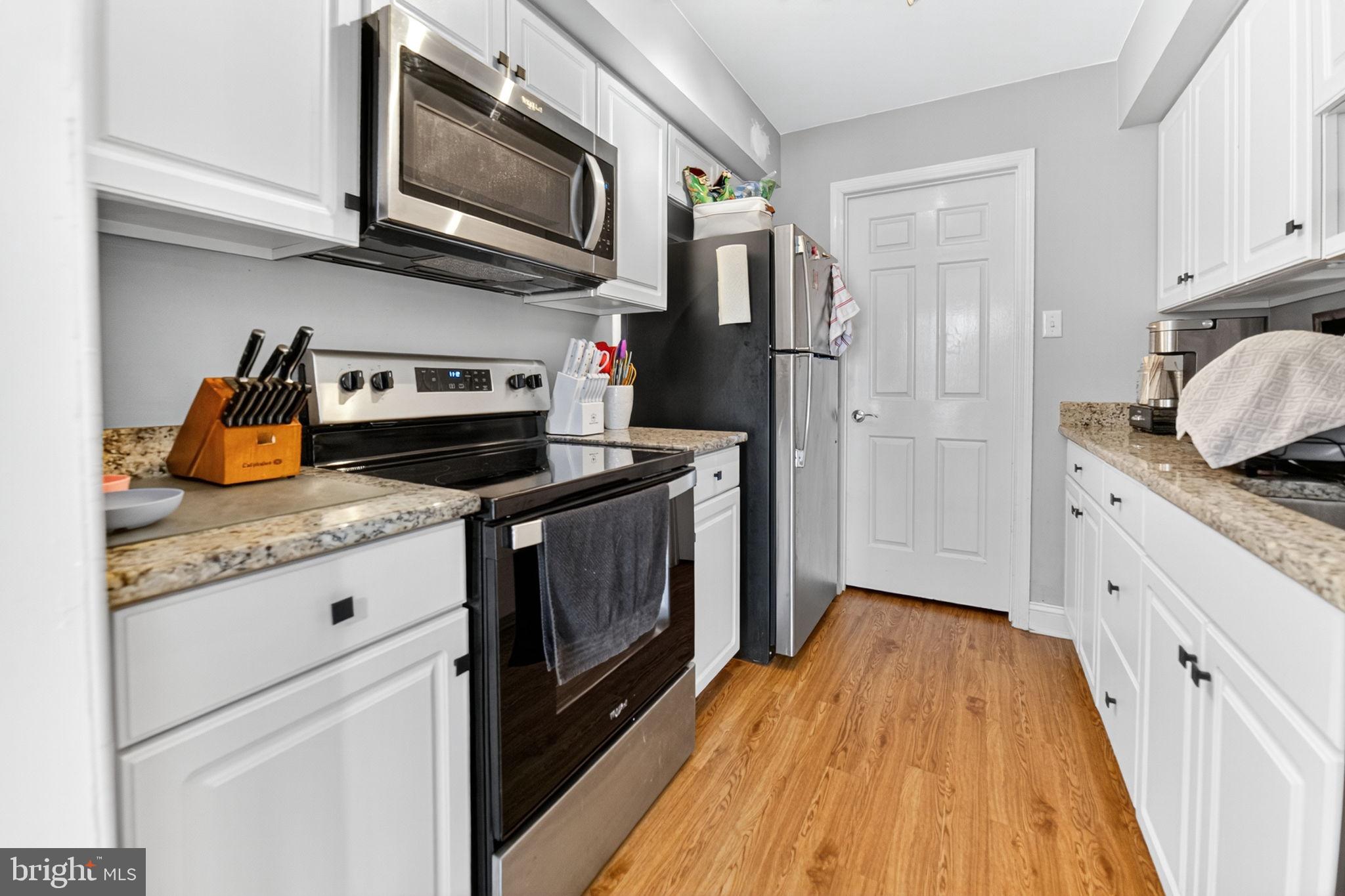 22 Meadow Lane New Hope, PA 18938 - Photo 9 of 21 a kitchen with stainless steel appliances kitchen island granite countertop a stove a sink and a refrigerator