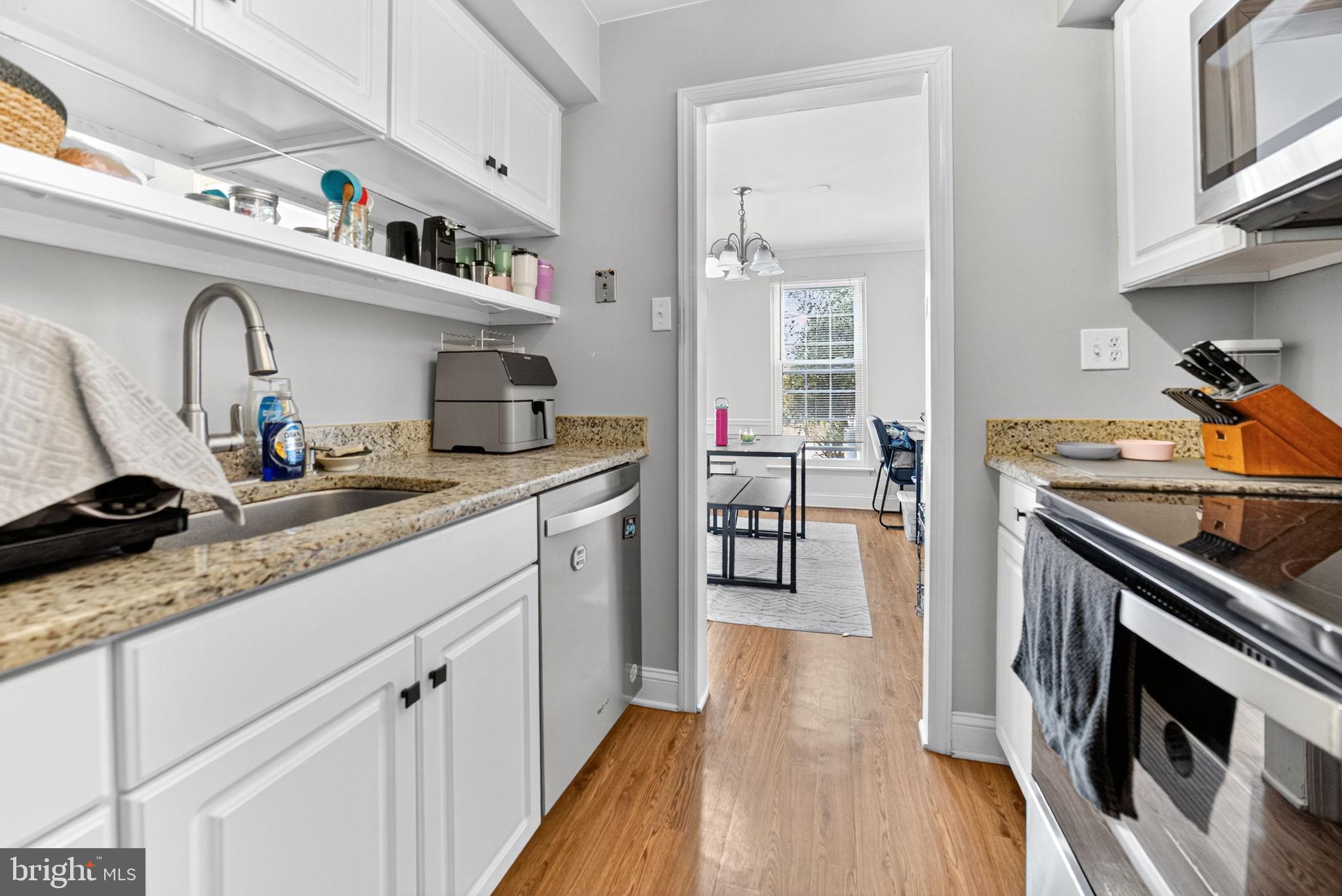 22 Meadow Lane New Hope, PA 18938 - Photo 10 of 21 a kitchen with stainless steel appliances granite countertop a stove a sink and a refrigerator