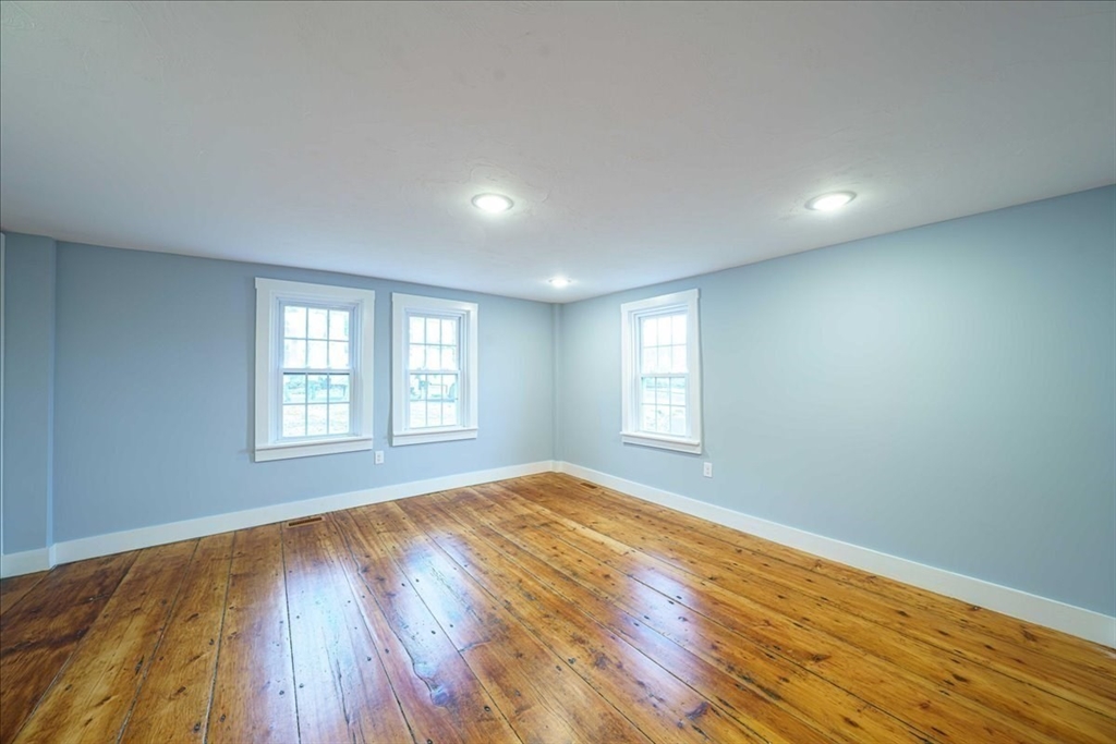 42 Silver Hill Road Milford, MA 01757 - Photo 12 of 30 a view of empty room with wooden floor and fan