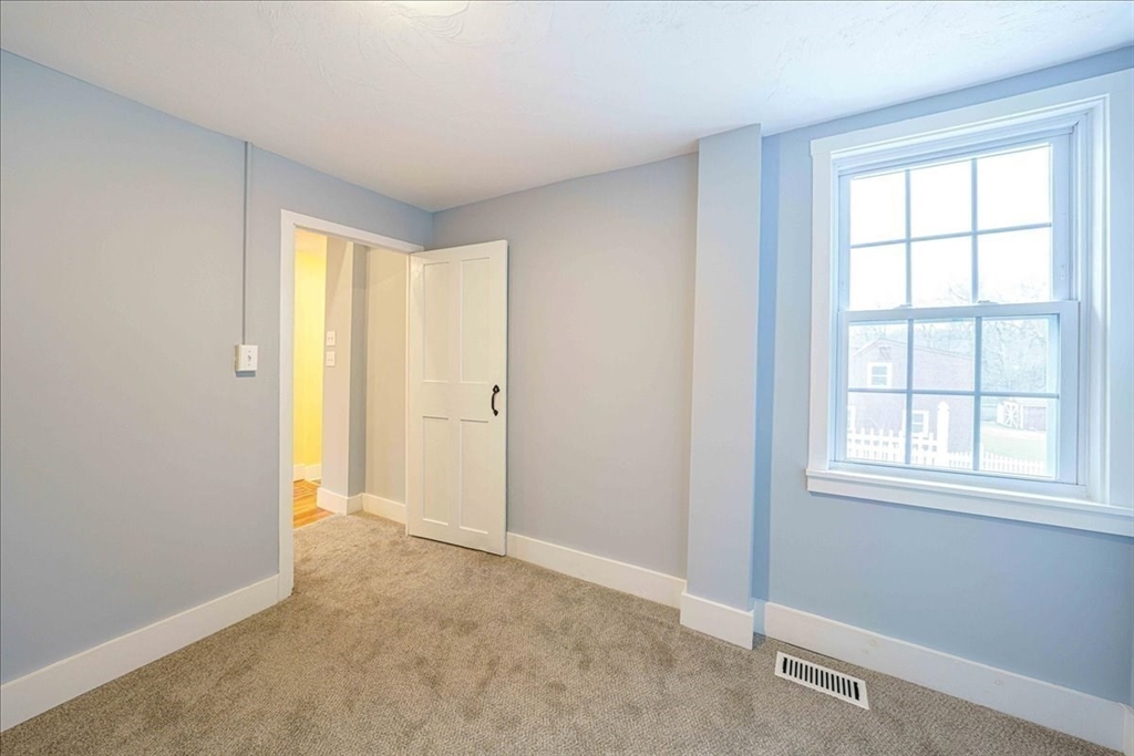 42 Silver Hill Road Milford, MA 01757 - Photo 22 of 30 an empty room with windows and closet
