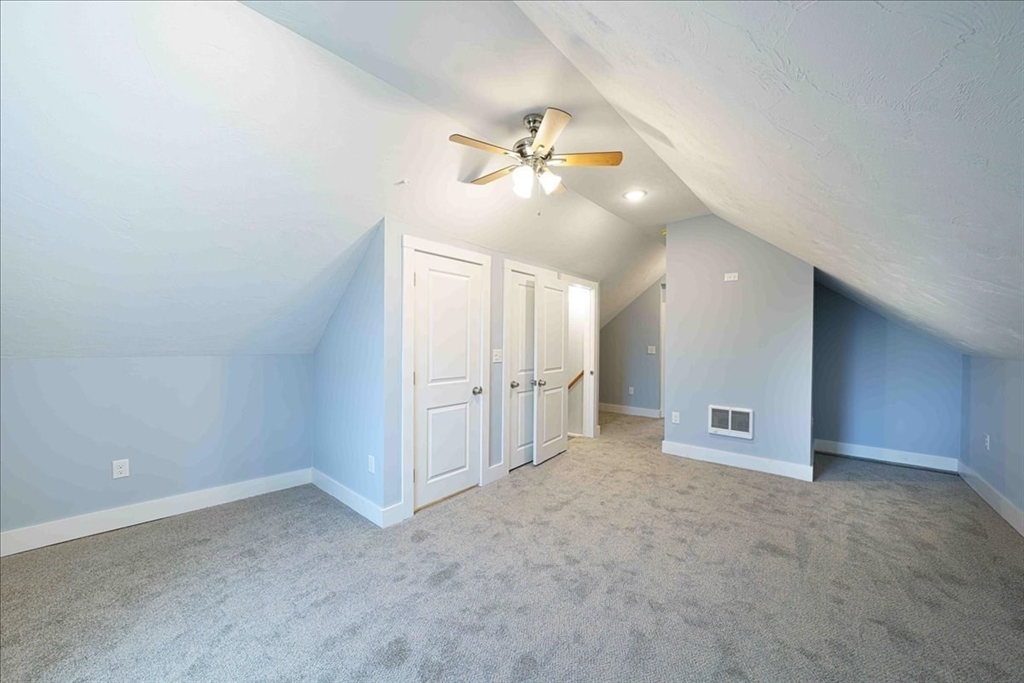 42 Silver Hill Road Milford, MA 01757 - Photo 24 of 30 an empty room with a ceiling fan and window