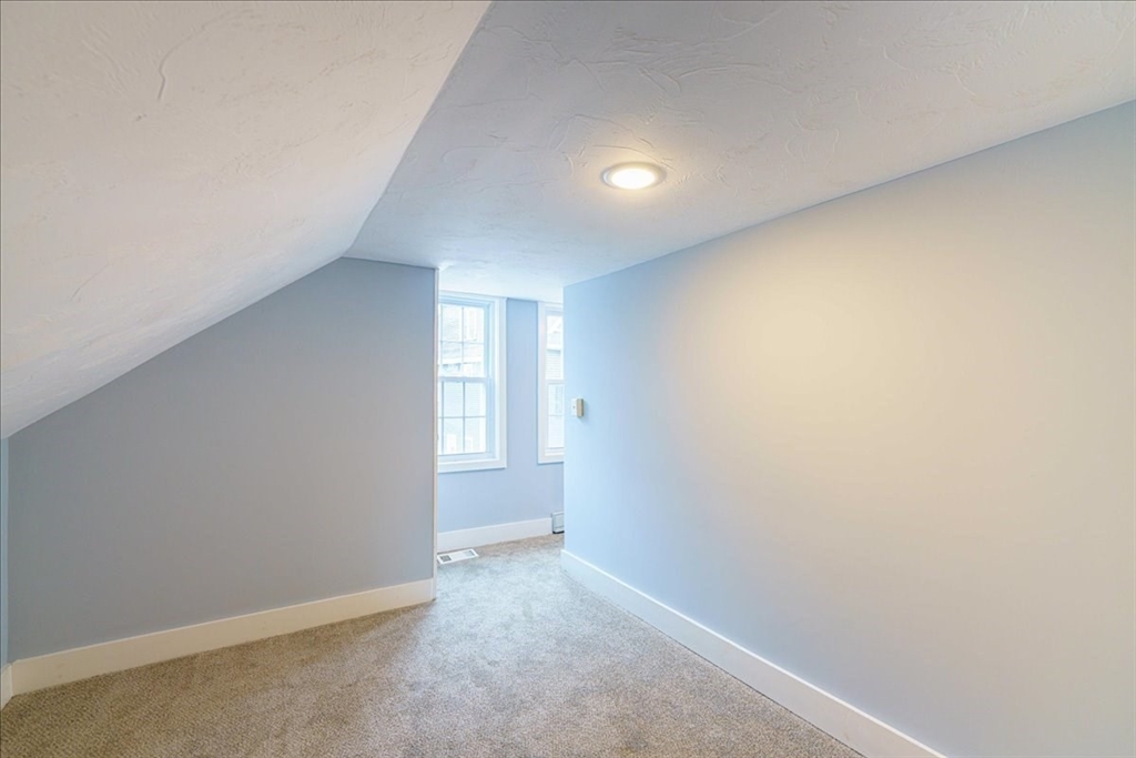 42 Silver Hill Road Milford, MA 01757 - Photo 27 of 30 a view of an empty room and a window