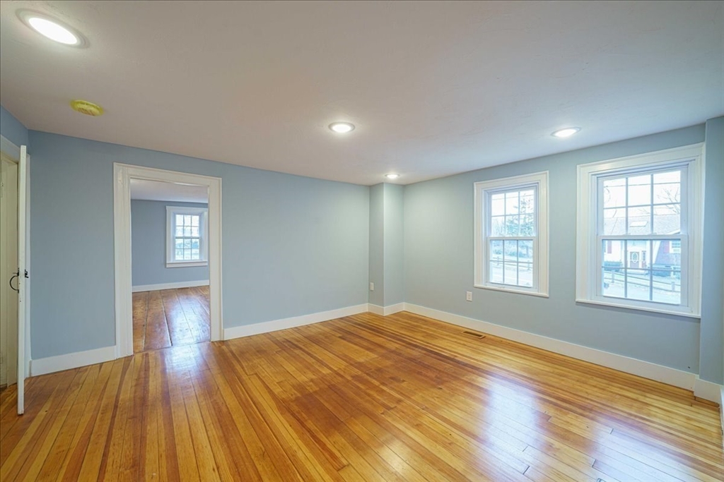 42 Silver Hill Road Milford, MA 01757 - Photo 9 of 30 a view of empty room with wooden floor and fan