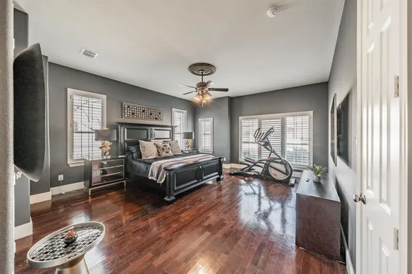 a bedroom with furniture and a window