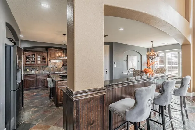 a room with dining table and chairs