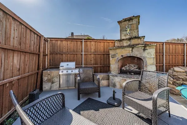 a living room with furniture a rug and a fireplace