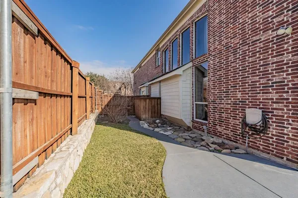 a view of a backyard with sitting area
