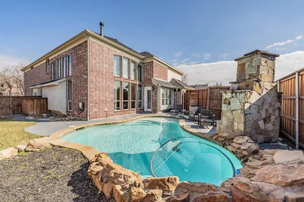 a view of a house with swimming pool