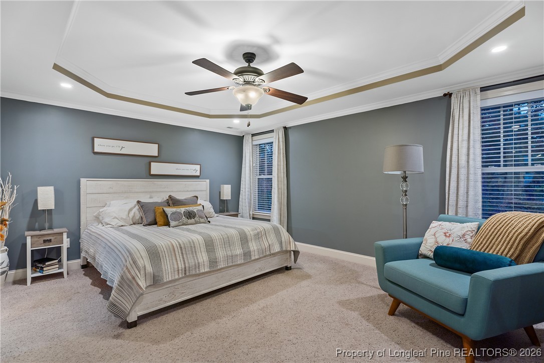 38 Overview Court Spring Lake, NC 28390 - Photo 17 of 50 a bedroom with a bed couch and window