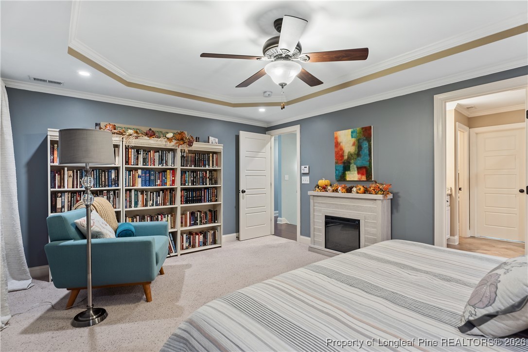38 Overview Court Spring Lake, NC 28390 - Photo 19 of 50 a bedroom with a bed cabinets and a book shelf