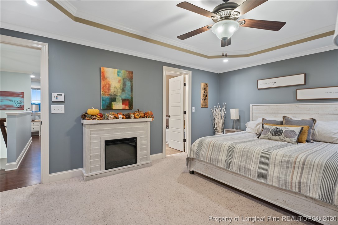 38 Overview Court Spring Lake, NC 28390 - Photo 20 of 50 a bedroom with a bed and a fireplace