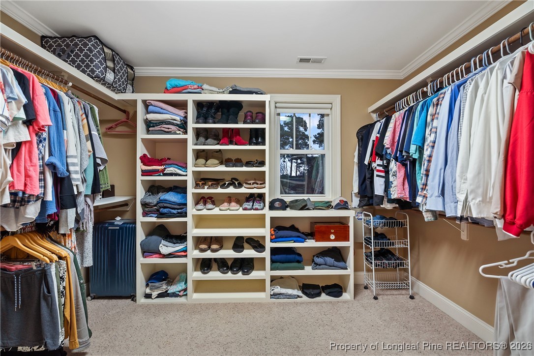 38 Overview Court Spring Lake, NC 28390 - Photo 26 of 50 a view of walk in closet with clothes and shoes