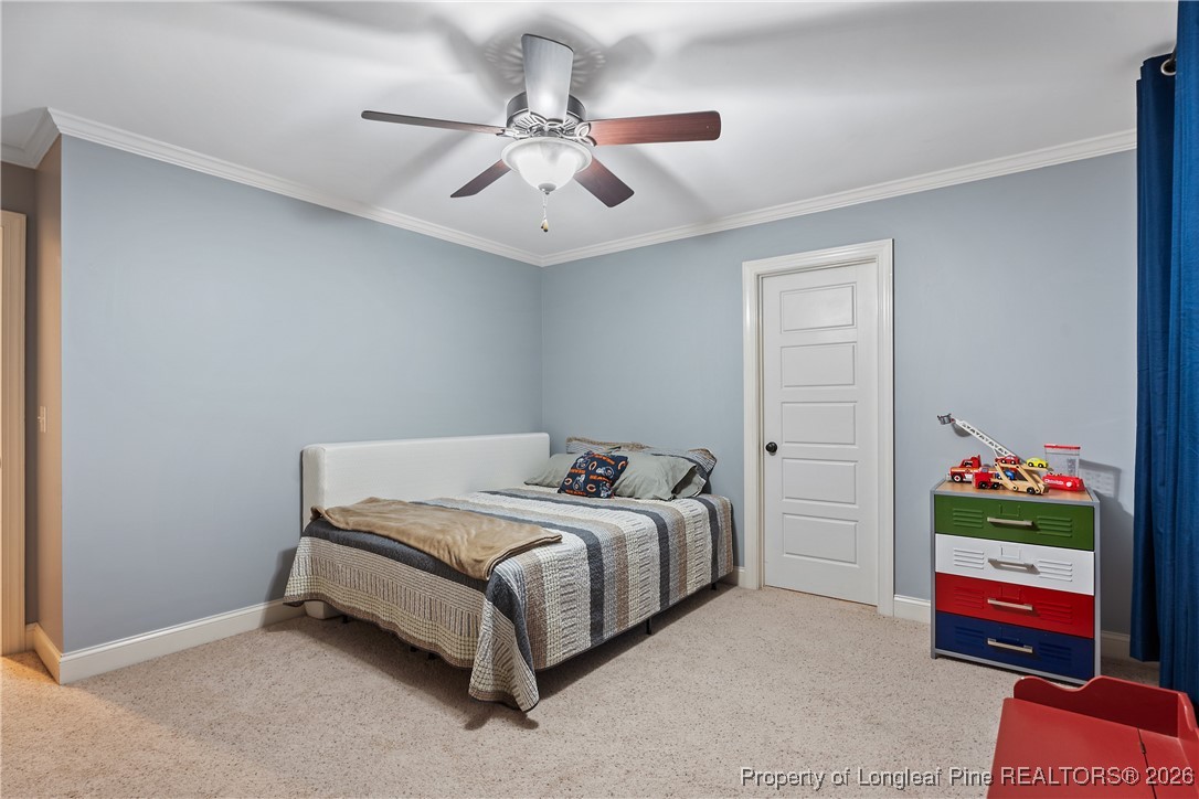 38 Overview Court Spring Lake, NC 28390 - Photo 30 of 50 a bed sitting in a bedroom next to a window