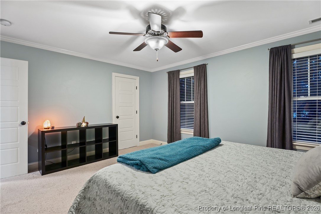 38 Overview Court Spring Lake, NC 28390 - Photo 36 of 50 a bedroom with bed and window