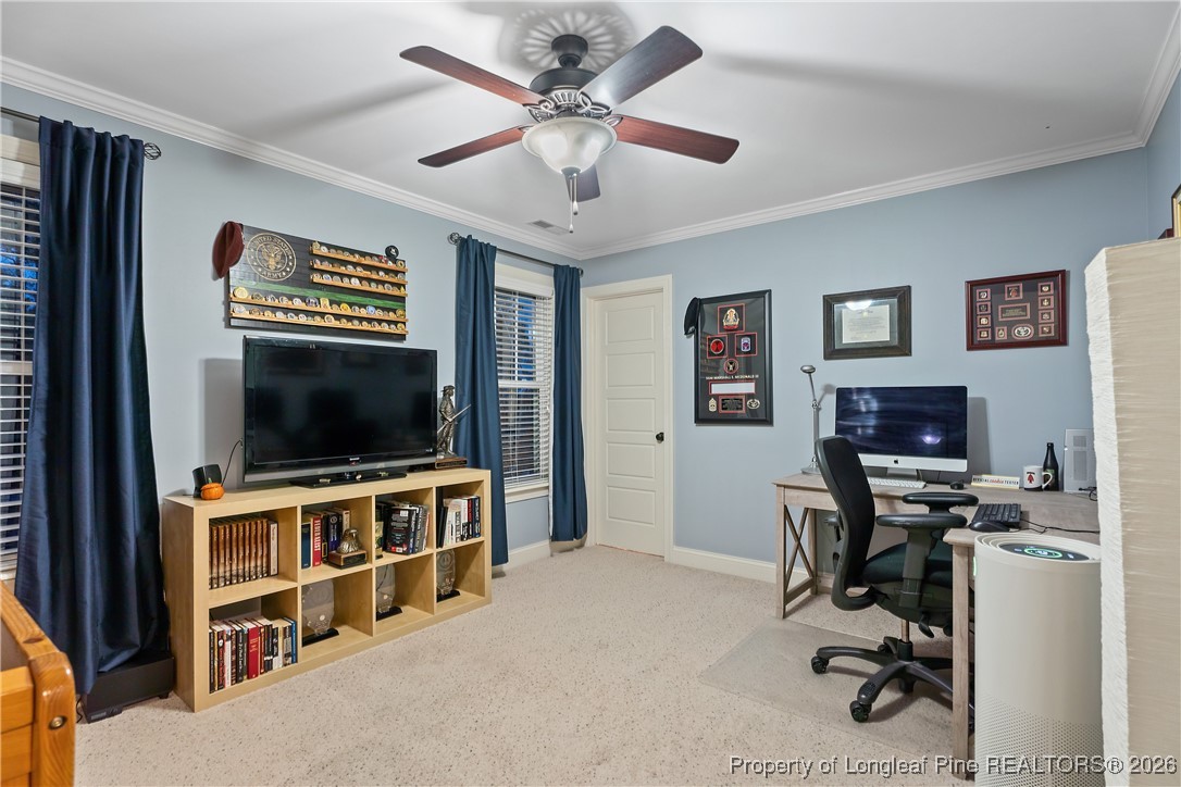 38 Overview Court Spring Lake, NC 28390 - Photo 39 of 50 a view of a livingroom with workspace and a flat screen tv