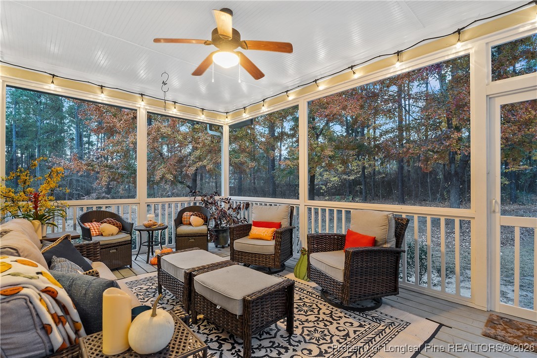 38 Overview Court Spring Lake, NC 28390 - Photo 43 of 50 a living room with furniture and a floor to ceiling window
