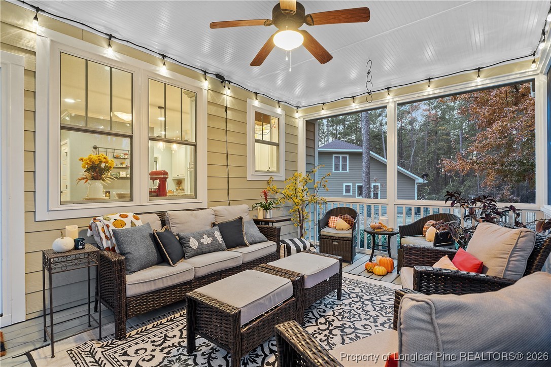 38 Overview Court Spring Lake, NC 28390 - Photo 44 of 50 a living room with furniture a rug and a large window