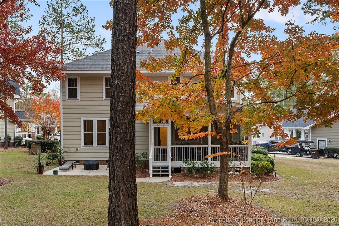 38 Overview Court Spring Lake, NC 28390 - Photo 45 of 50 a view of a patio with table and chairs and potted plants