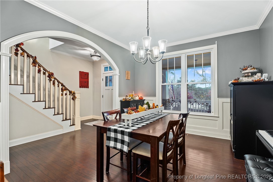 38 Overview Court Spring Lake, NC 28390 - Photo 7 of 50 a view of a dining room with furniture a chandelier and wooden floor