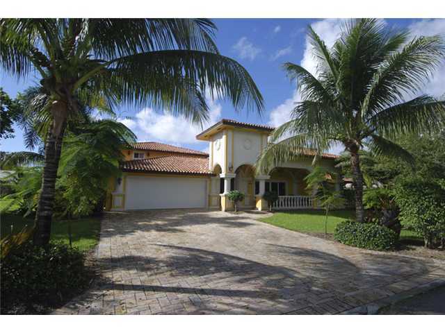 1900 Sharon Street Boca Raton, FL 33486 - Photo 1 of 21 a front view of house with yard and trees