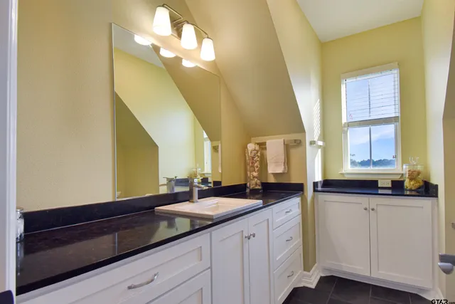 a bathroom with a shower toilet and sink