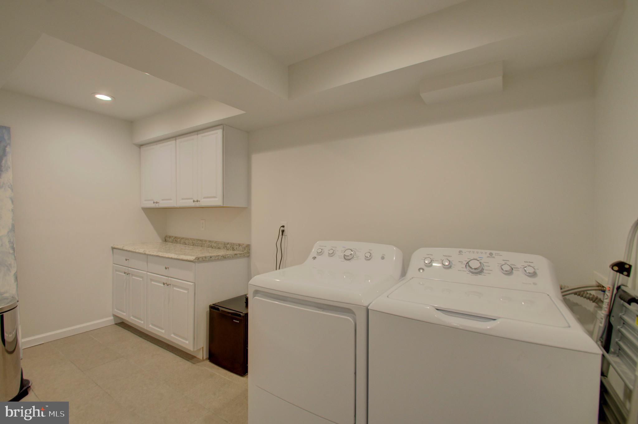6412 Wainfleet Court Springfield, VA 22152 - Photo 38 of 43 Large laundry room with folding station.