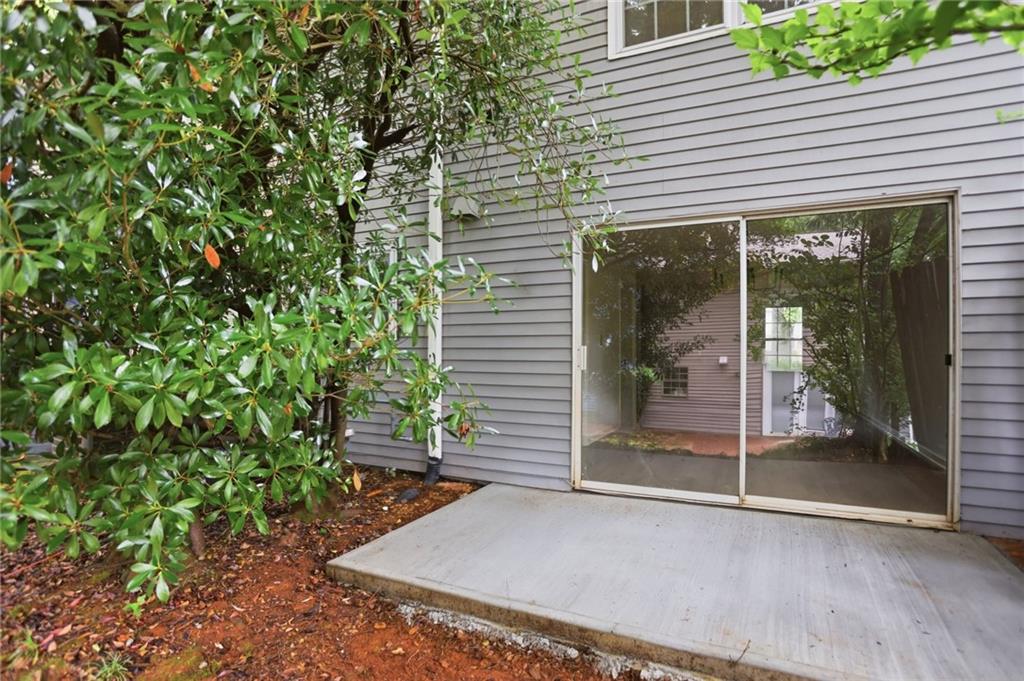 413 Promenade Court Marietta, GA 30064 - Photo 23 of 28 a view of a backyard with a garden